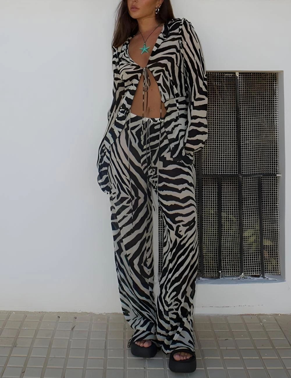 Zebra Print Bliss: Tie-Up Blouse & Trousers Two-Piece Set. Effortless chic for your wardrobe.